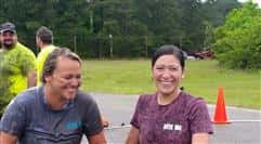 Two contestants smiling