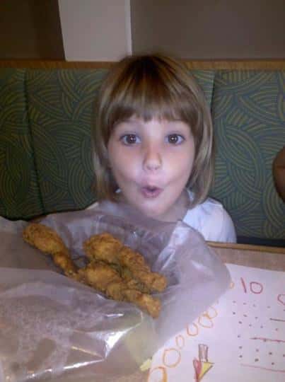 a kid in front of her menu item