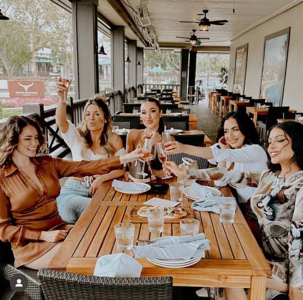 Girls drinking wine Ladera