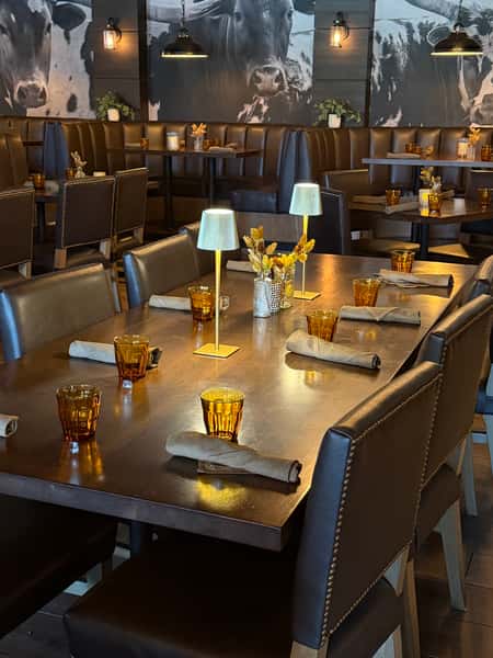 Dining table setup with glassware and silverware