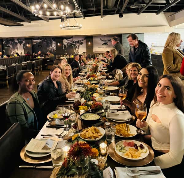 Guests attending a wine tasting event