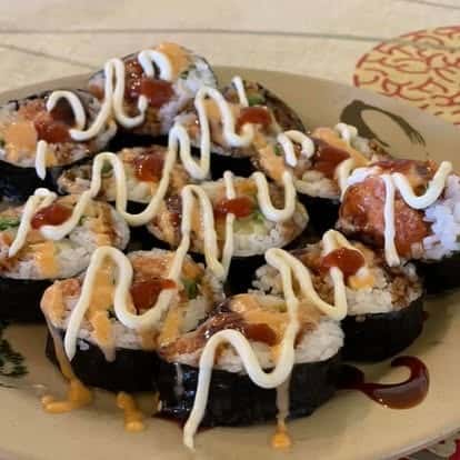 Sushi rolls drizzled with spicy mayo and eel sauce