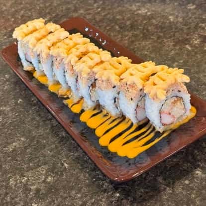 Sushi rolls arranged on a serving tray, showcasing catering options