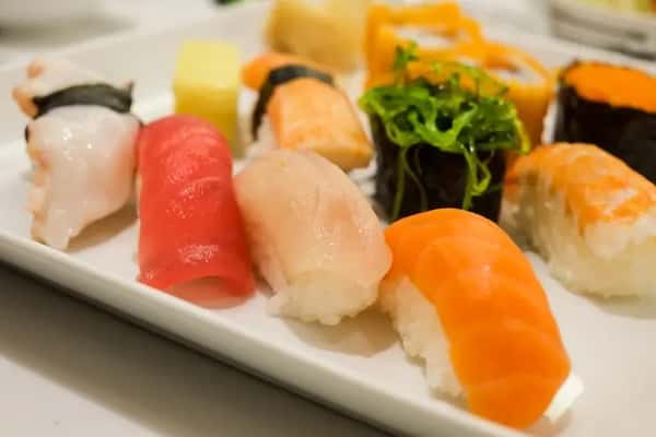 Assorted nigiri sushi platter with salmon, tuna, and shrimp
