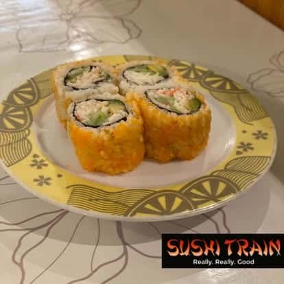 Golden tempura sushi rolls served on a decorative plate