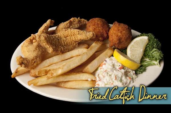 fried catfish dinner with french fries and hush puppies