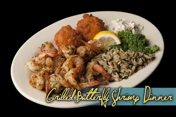 grilled butterfly shrimp dinner with rice and hush puppies