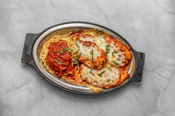 Fried eggplant with pasta, topped with melted mozzarella and tomato sauce