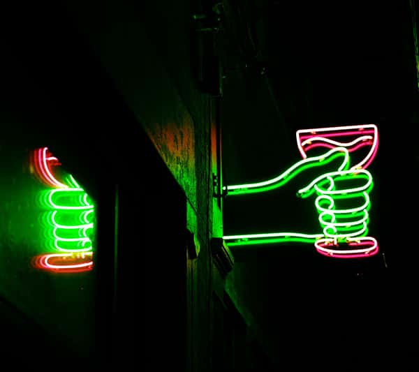 Neon sign of a drink in a hand
