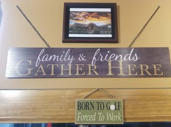 a sign that says "family & friends gathere"