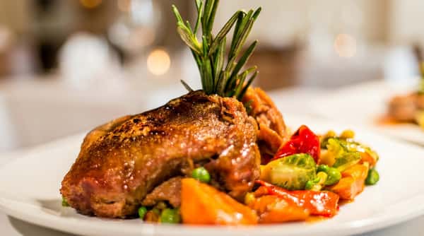 Roasted duck with seasonal vegetables at Local on North, an elevated Southern-inspired restaurant in Georgia