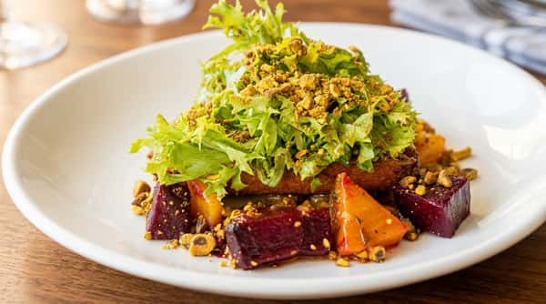 Roasted beet salad with fresh greens and seasonal ingredients at Local on North in Canton and Marietta GA