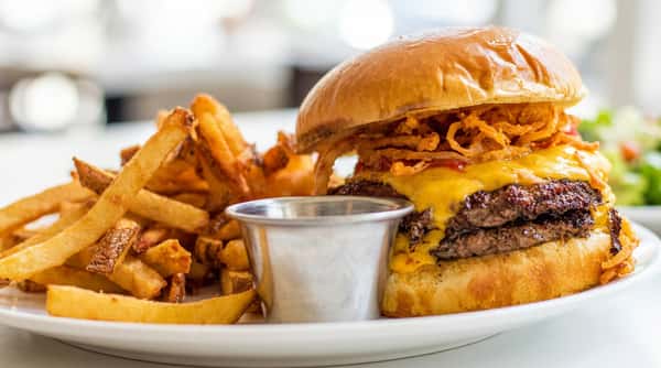 Juicy cheeseburger with hand-cut fries at Local on North, a chef-driven American restaurant and bar in GA