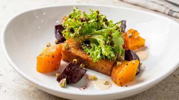 Duck terrine salad with roasted vegetables and fresh greens at Local on North in Canton and Marietta GA