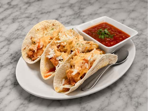 Shrimp tacos topped with house-made slaw and served with fresh salsa at Local on North, featuring coastal-inspired seafood and elevated Southern flavors in Canton and Marietta.