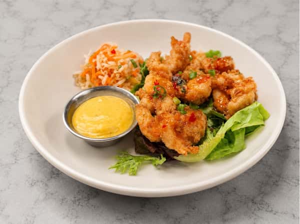 Bang Bang shrimp tossed in a creamy spicy sauce, served with house-made slaw and signature dipping sauce at Local on North, featuring coastal-inspired Southern flavors in Canton and Marietta.