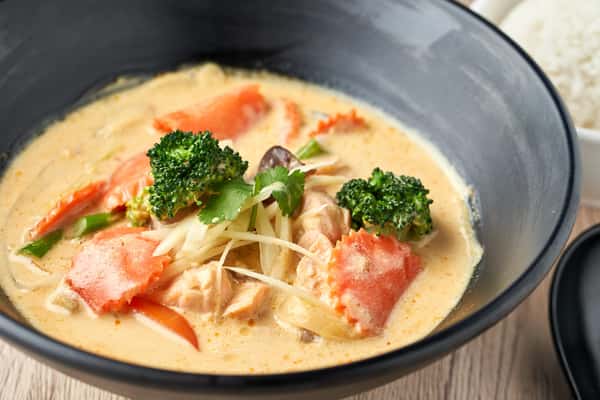 Creamy Thai soup with vegetables and fresh herbs.