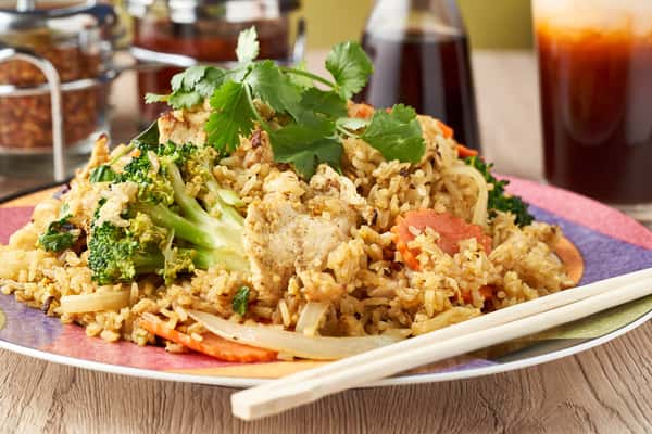 Chicken fried rice with vegetables and fresh cilantro.