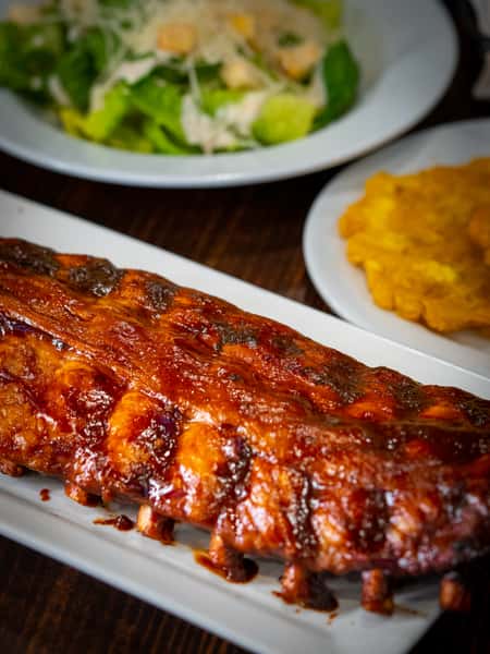 Costillar De Puerco BBQ “Baby Back Ribs” / Pork Ribs “Baby Back Ribs” with BBQ Sauce.