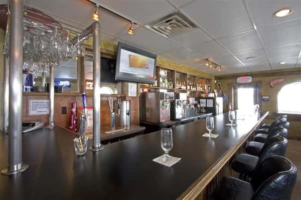 Bar counter with big screen tv in the background