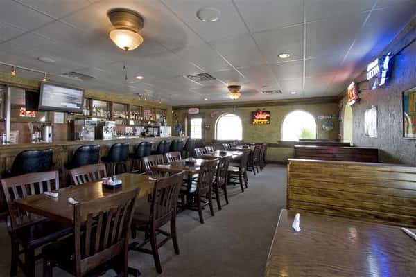 Interior of the restaurant with tables and chairs set