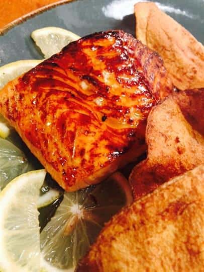 Salmon over lemon with side of chips