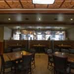 Chairs, tables, and booths inside restaurant