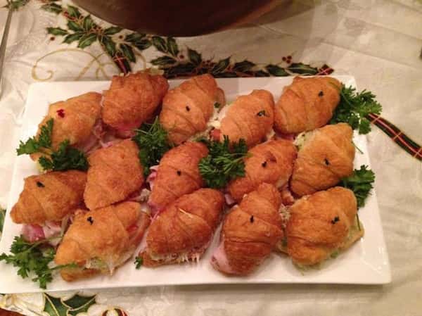 small croissant sandwiches on a plate
