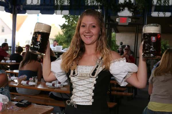 Lady holding mug of beer
