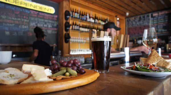 cheese and fruit platter, beer on bar