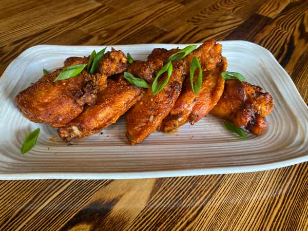 Baked low and slow, then fried to perfection. Choose from classic Buffalo, sweet & hot, or Chango's fiery BBQ. Served with your choice of creamy ranch or tangy blue cheese.