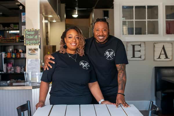 Owners posing inside Southern Harvest