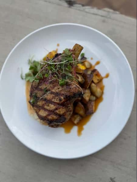marinated & grilled center cut pork chop | local squash & heirloom potatoes | beef tallow - jalapeño butter | hot honey