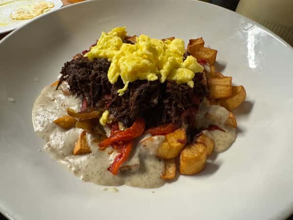 Scramble eggs with hash browns and pulled pork
