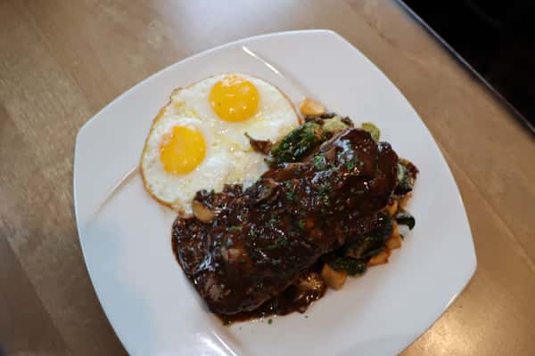 Ribs with barbecue sauce and fried egg