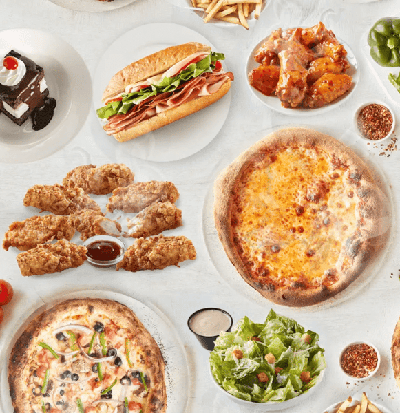 Hero image of spread of dishes on white table
