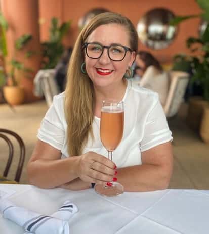 carly walsh with glass of bubbly rose