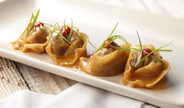 oxtail dumplings sriracha onions