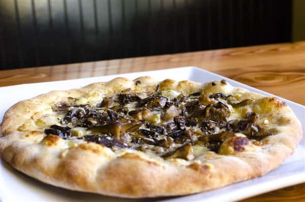 Veggies Pizza. red onions, tomatoes, mushrooms, green peppers, olives, roasted garlic, banana peppers, artichoke, roasted peppers, spinach, pineapple