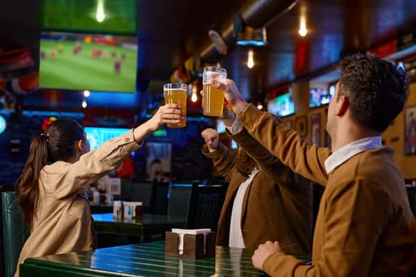 Friends sharing drinks at a party
