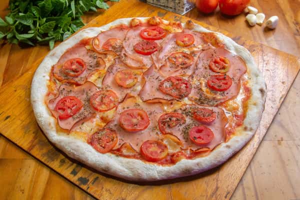 Pizza close up with tomato slices