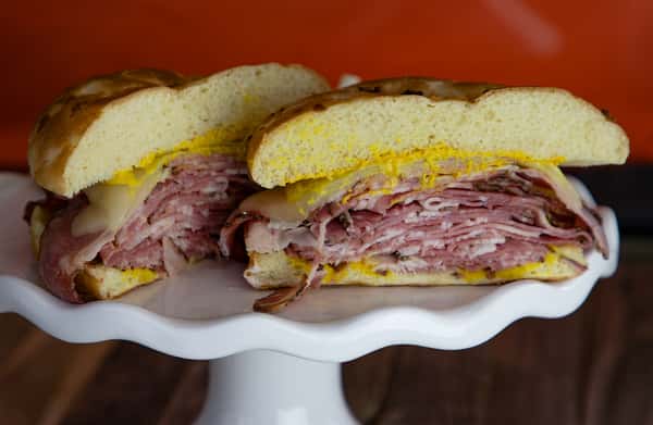 HOT PASTRAMI ON ONION ROLL WITH PICKLES AND SIDE SALAD Menu Butch's