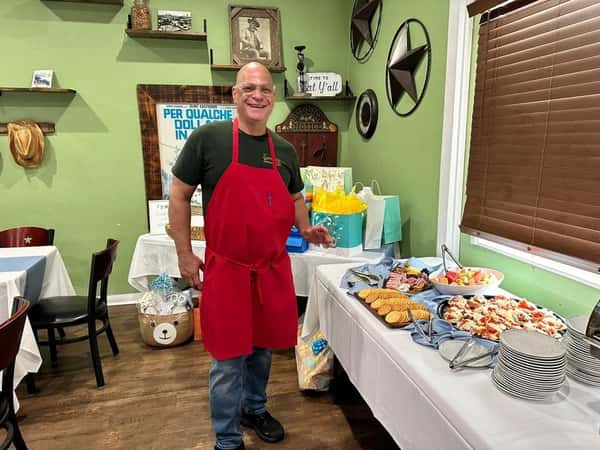 Chef enjoying dishes on a table
