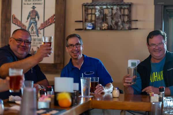 Customers happily enjoying drinks