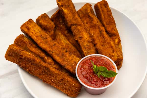 crispy breaded eggplant sticks served with marinara sauce for dipping