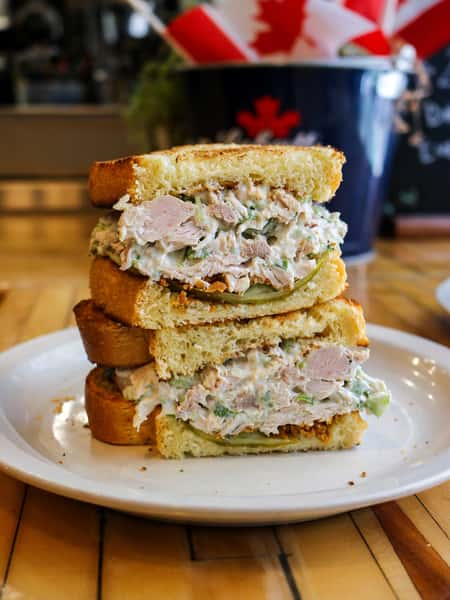 House-made chicken salad piled high on toasted challah bread, topped with crispy gribenes (chicken cracklings) and crunchy pickles