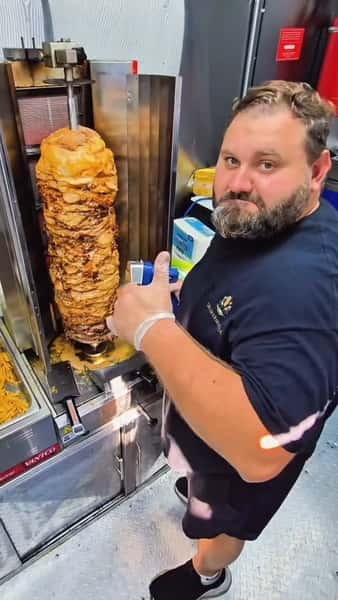 staff beside Shawarma
