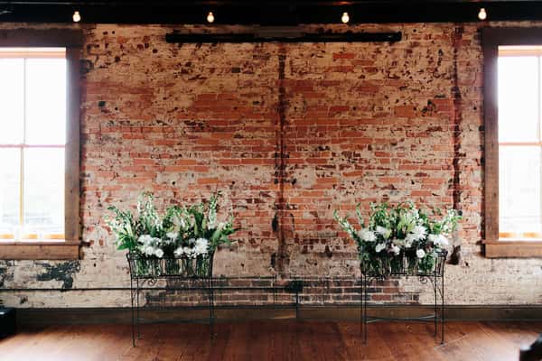 private event florals wedding brick wall