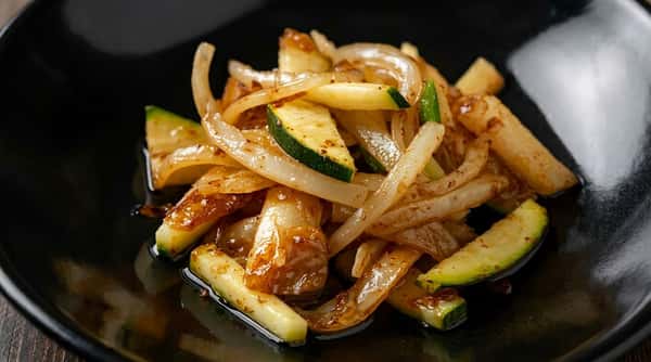 Sautéed zucchini and onions cooked until tender with a light savory glaze