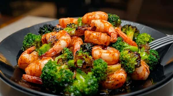 Shrimp and broccoli stir-fry tossed in a flavorful savory sauce and served hot